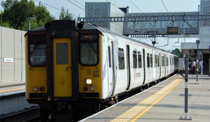Greater Anglia class 317 883 in platform 2 at Cambridge North 