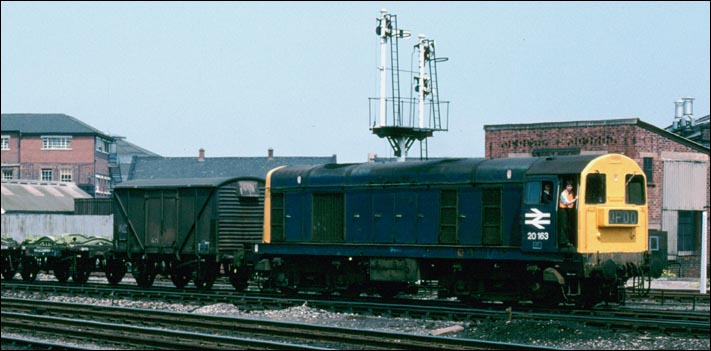 1978 alongside Derby station still with signals and a class 20 number 20163 on a mixed freight. 