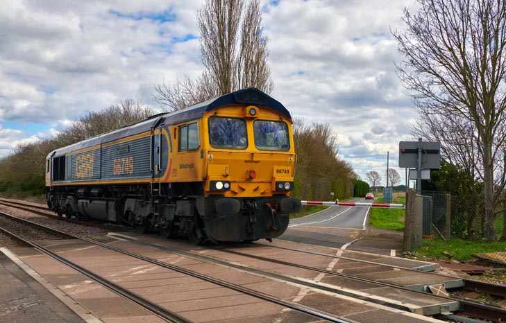 Class 66749 Christopher Hopcroft MBE light engine on the crossing at Eatrea 