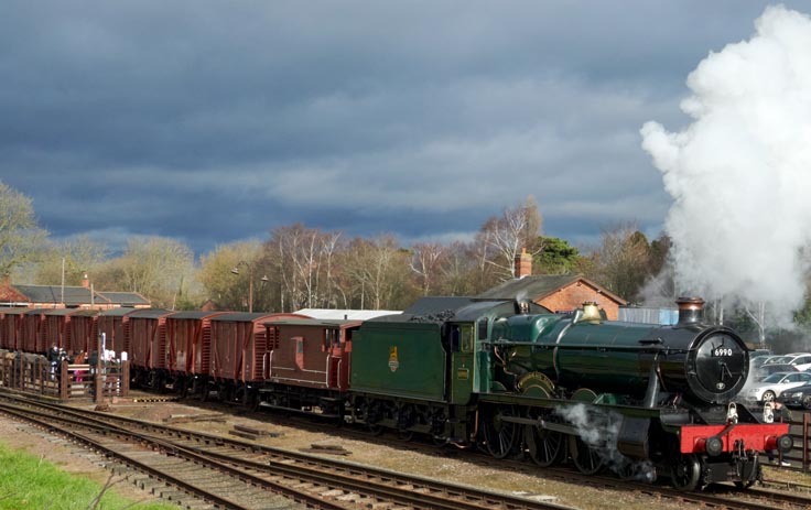 GWR 4-6-0 6990 with a freight of vans at Quorn and Wood House 