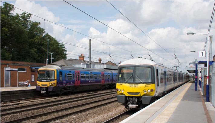 First Capital Connect class 365508 platform 2 and 365522 in platform 1 at Hitchin on Friday the 1st of August 2014