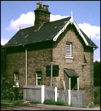 Gate house at level crossing north of Holme from track side.