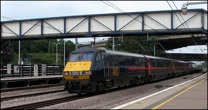 GNER up train on the up fast though Huntingdon station 2006. 