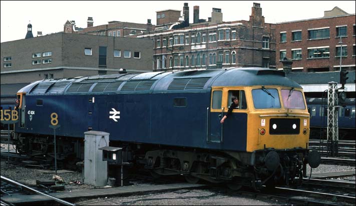 Class 47 404 backs onto its train at Kings Cross