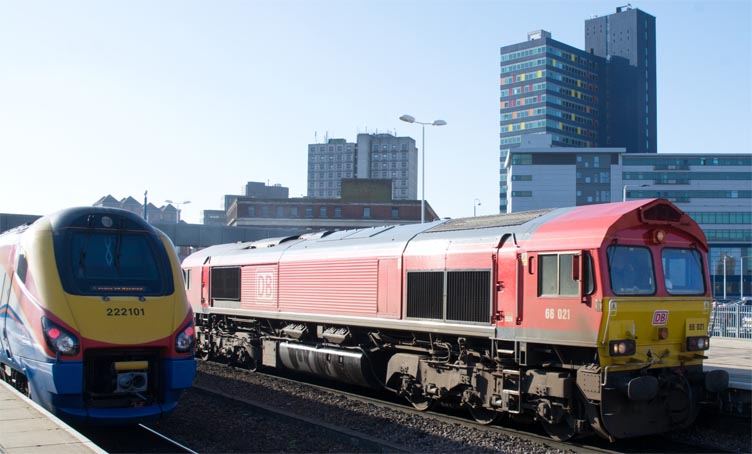 DB class 66021in DB red and EMR 222101 at Leicester station 