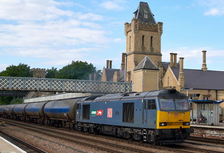 DB class 60074 in Puma Energy blue named 'Luke' with oil tank wagons at Lincoln station 