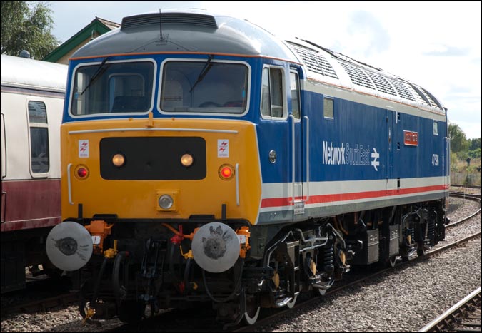Class 47596 in Network South East colours between turns on the 21st September 2012 at Dereham