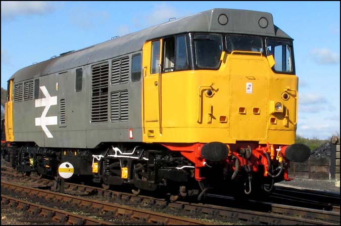  Class 31 with large arrows and no number coming off shed at Weybourne 