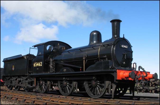 J15 65462 in British Railways unlined black coming off shed at Weybourneat 