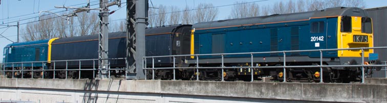 Two class 20s in BR Blue coming into the Leicester line high level platforms at Nuneaton staton 