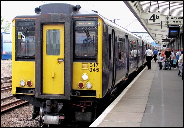 First Capital Connect 317 345 in platform 4b at Peterborough