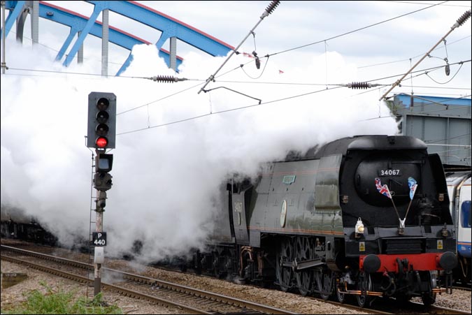 The Cathedrals Express with SR Light Pacific Class    4-6-2 number 34067 Tangmere on the down fast at Peterborough station on the 13th April 2011 