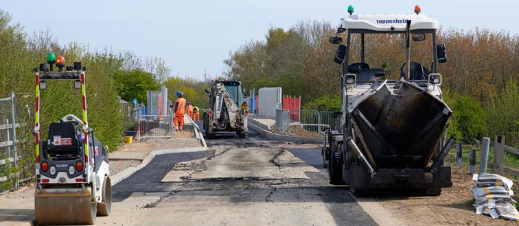 Work on tarmacking the road way over the two bridges above on the 26th April 2021