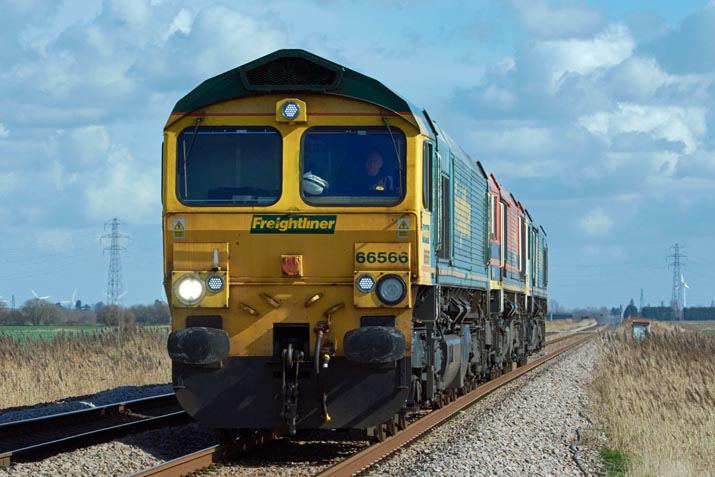 Three Freightliner class 66s with 66566 leading at Turves on the 14th March 2022 