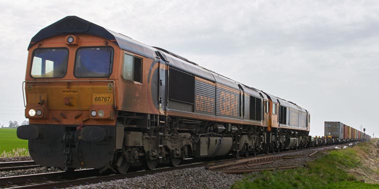 Two GBRF class 66s with class 66767 leading between Turves and March