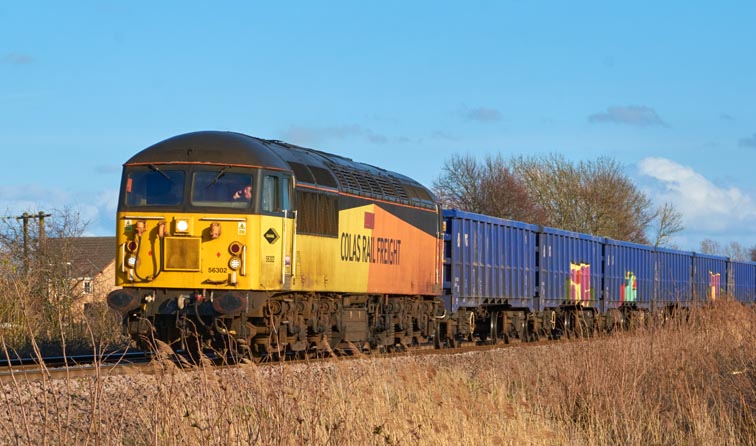 Colas Rail Freight at Black Bush level crossing  at Whitlesea on the 9th March in 2022