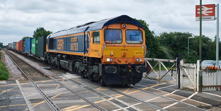 GBRf class 66753 at Whittlesea station level crossing on 15th July 2021