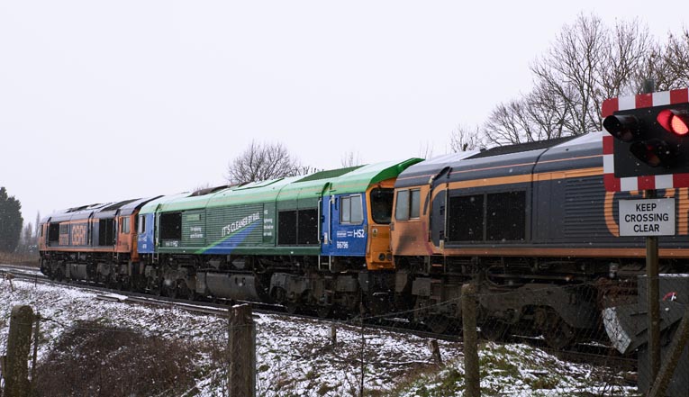 Three GBRf class 66s from Whitemoor to Peterborough at the Ramsey Road crossing