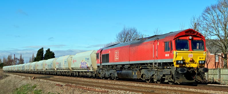 DB class 66027 at Whitlesea on the 20th of February  in 2023