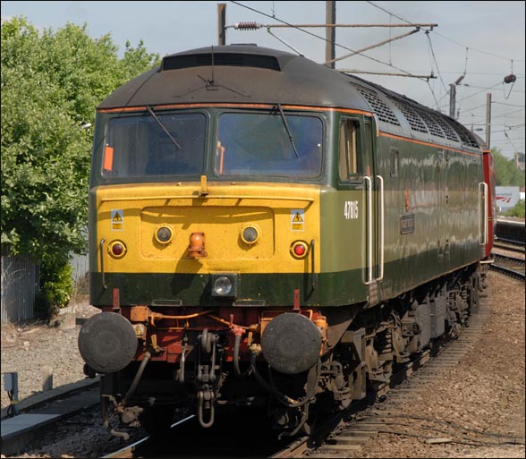 class 47815 at the rear of the train as it leaves York 