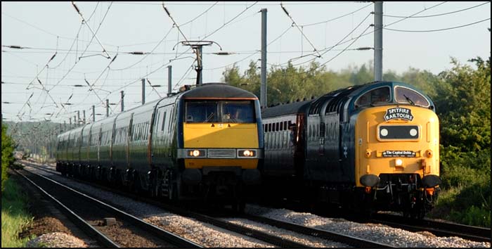 East Coast class 91 on the down fast and a Deltic on the down slow at Conington in 2010