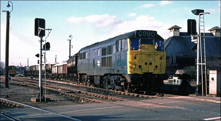 A class 31 leaves Kings Lynn with a full train of sand 