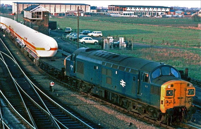 Class 37118 comes out of Whitemoor yard with a train of tank wagons. 
