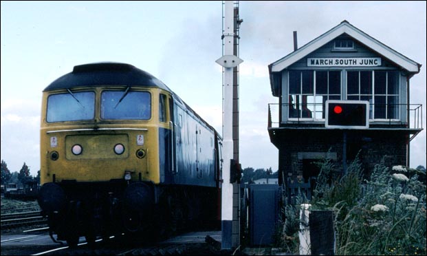 A class 47 next to the March South Junction signal box.