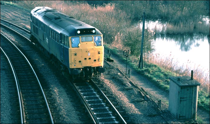 A class 31 light engine comes round the eastern side of the triangular junction at Whitemoor