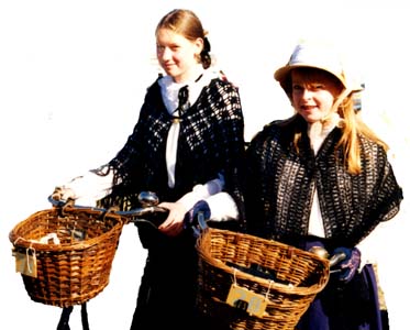 two young ladys with vintage cycles