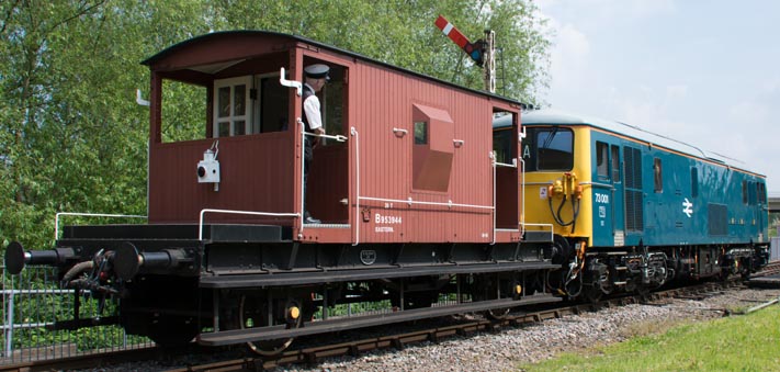 Class 73001 and a brake van come in Orton Mere station 