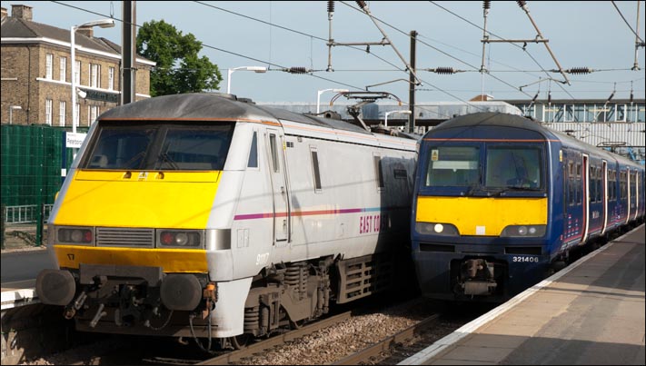 East Coast class 91117 in platform 2 and First Capital Connect class 312406 in platform 3 on the 17th of June 2013