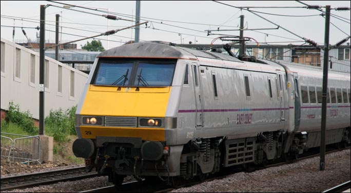 East Coast class 91129 on the down fast in Peterborough station on the 17th of June 2013