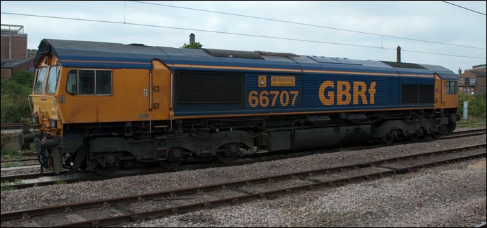 GBRf 66707 with the name Sir Sam Fay The Great Central Railway in the goods loops at Peterboroughon station on 28th April 2011