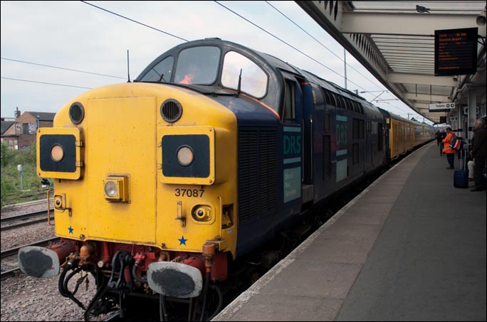 DRS class 37087 in platform 5 at the rear  of the same (top and tail) of a Network Rail test train on the 28th of April 2011