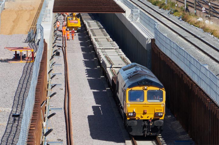 GBRf class 66706 in the dive under at Werrington with a train load of sleepers on the 17th July in 2021.