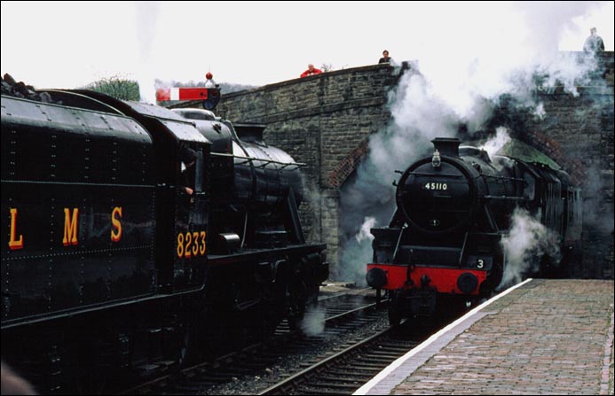 LMS Stanier Class 8F no.8233 waits as 45110 comes into the Arley