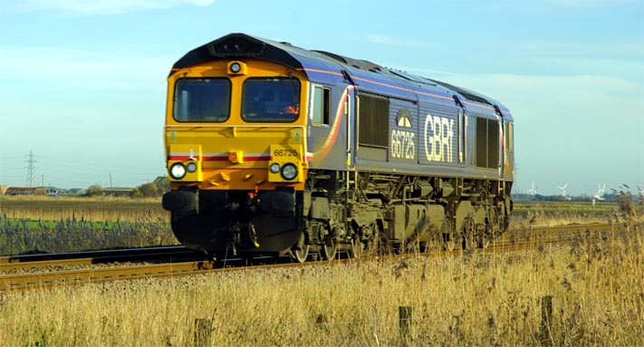 GBRf Class 66725 heading for Peterborough light engine on the 10th of January 2014 at Turves 