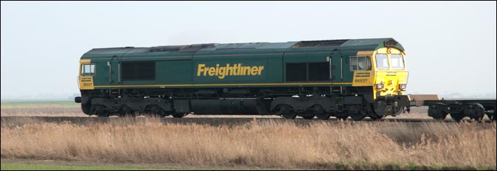 Freightliner class 66537 at Turves heading for March on the 29th March 2011