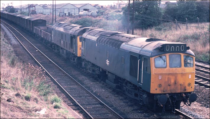 Class 25211 and class 25065 on a long freight at the north end of Wellingborough on the down slow