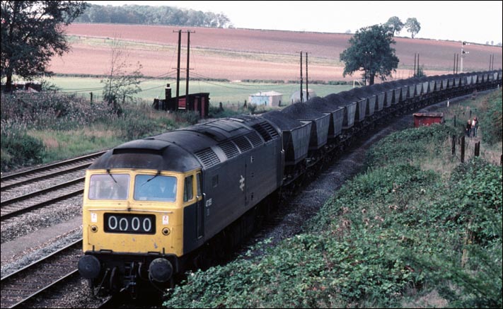 Class 47355 on a full merry-go-round coal train 